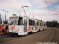 Vůz KT8D5 ev.č.9001 vypravený na linku 8 s celoplošnou reklamou JVC stanicuje v zastávce Vozovna Střešovice | květen 1998