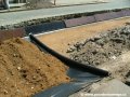 Úplně vespod nové tramvajové tratě leží izolační geotextilie. | 29.5.2004