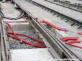 Vynechaný prostor v obnovené betonové desce pod rozjezdovou výhybkou na předjízdnou kolej křižovatky Letenský tunel pro uložení přestavníku. | 29.7.2007