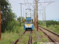 ...a ve směru k ocelárnám se blíží druhý z vozů T6A5 obsazujících pořadí linky R1 ev.č.607. | 14.7.2012