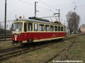 Motorový vůz 411 901-2 v historizující podobě laku projíždí kolejiště depa v Trenčianské Teplé do nástupní zastávky TREŽ. | 15.3.2009