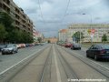 Tramvajová trať pokračuje středem ulice Milady Horákové ke světelně řízené křižovatce s Korunovační ulicí a vyústěním Letenského tunelu