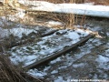 Znovuobjevený kolejový oblouk tramvajových žlábkových kolejí v areálu Nákladového nádraží Žižkov již s ukradenou žulovou dlažbou. | 22.1.2006