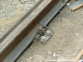 Upevnění kolejnice, obalené pryžovými bokovnicemi, pomocí podkladnice na původní betonovou desku. | 3.9.2006