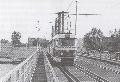 Souprava vozů T3 projíždí po původním tramvajovém mostě k zastávce Trojská [Foto: archiv]