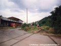 Lokomotiva T 203.0504 společně s vyřazeným vozem T3 ev.č.6583 v areálu nákladových kolejí nádraží Praha-Smíchov | 31.8.1995