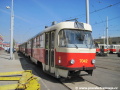 Odstavený vůz T3SUCS ev.č.7042 z roku 1983 v koloně odstavených vozů na koleji před objektem oděvního skladu. | 11.4.2012