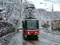 Souprava vozů T6A5 ev.č.8681+8682 vypravená na linku 9 projíždí zasněženým nábřežím Edvarda Beneše | 23.1.2005
