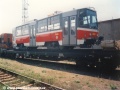 Vůz T6A5 ev.č.8689 ložený na plošinovém voze na nádraží ČD Praha-Zličín. | září/říjen 1996