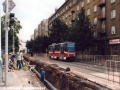 Vůz T6A5 ev.č.8714 vypravený na linku 14 projíždí po nesprávné koleji staveništěm u zastávky Osadní (dnes Ortenovo náměstí) | 5.8.2002