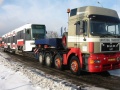 Vůz RT6N1 ev.č.9101 cestuje zimní krajinou na silničním tahači do šumperské firmy Pars Nova, a.s. k úpravě na typ RT6N2. | 21.1.2004