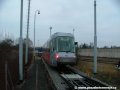 Na předávací koleji Zličín stojí tři plošinové vozy naložené tramvají Škoda 14T ev.č.9114 | 22.12.2006