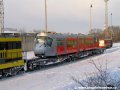 Na třech plošinových vozech ložený vůz Škoda 14T ev.č.9117 na nádraží Praha-Zličín. | 27.1.2007