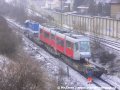 Lokomotiva 740 469-2 posunuje přes pražské zhlaví železniční stanice Praha-Zličín vůz Škoda 14T ev.č.9122 k rampě předávací koleje. | 22.3.2007