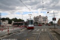Vůz Škoda 14T Elektra #9145 vypravený na linku 10 odbočuje křižovatkou Strojimport k Olšanským hřbitovům. Ve vozovce probíhá rekonstrukce vodovodního řadu. | 22. 7. 2026